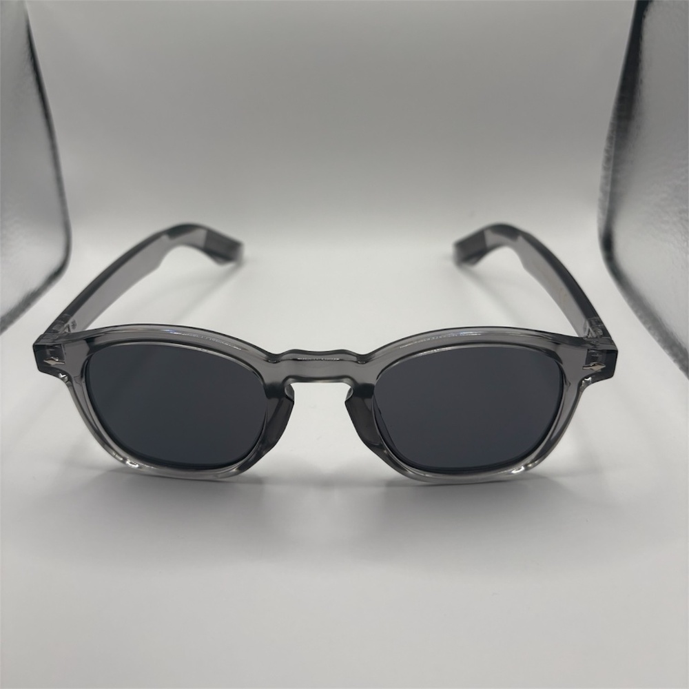 Gray round frame sunglasses with dark tinted lenses